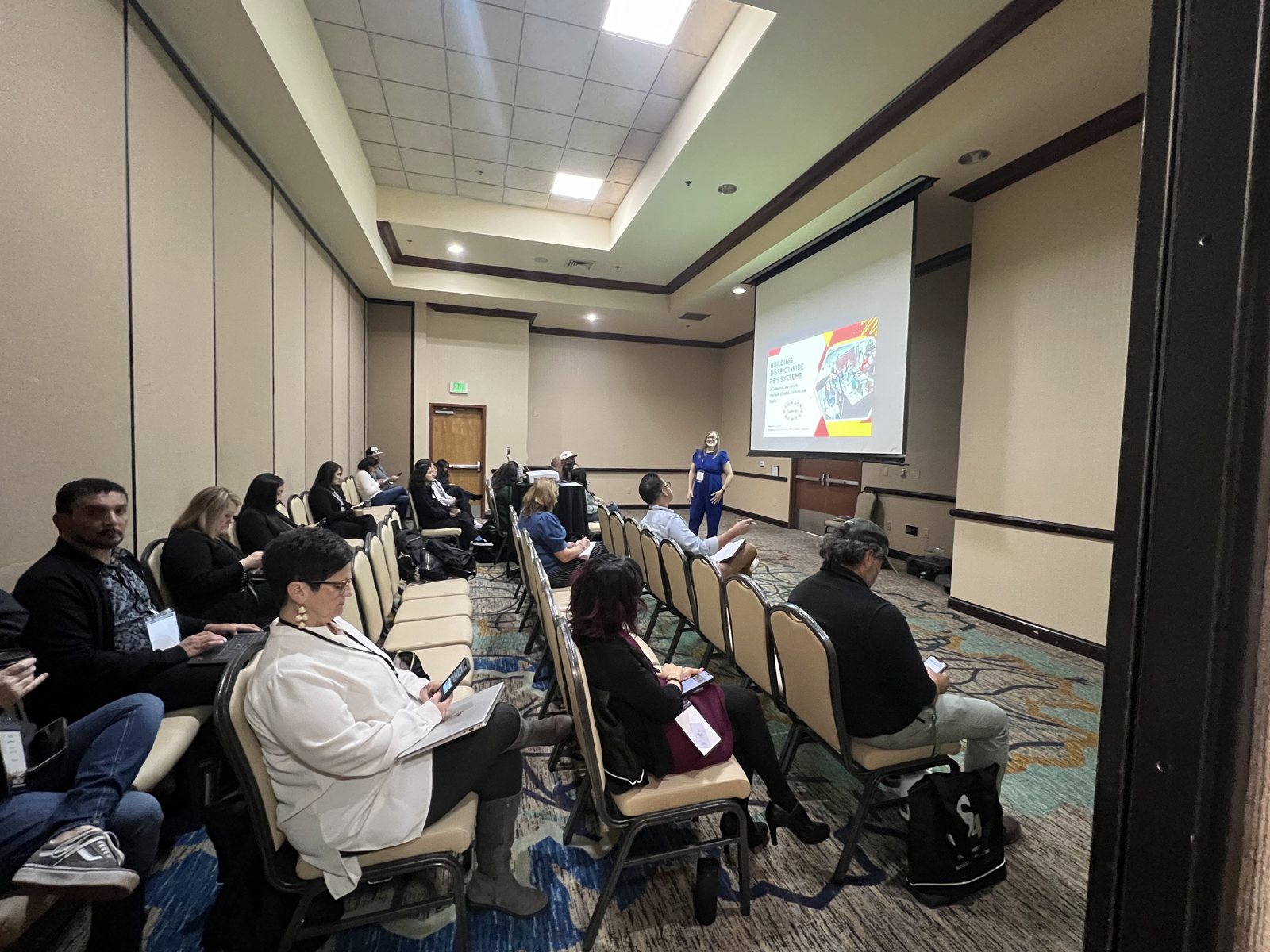 A full room of educators at Dr. Jessica Rose Mathy's CASCWA 2025 session